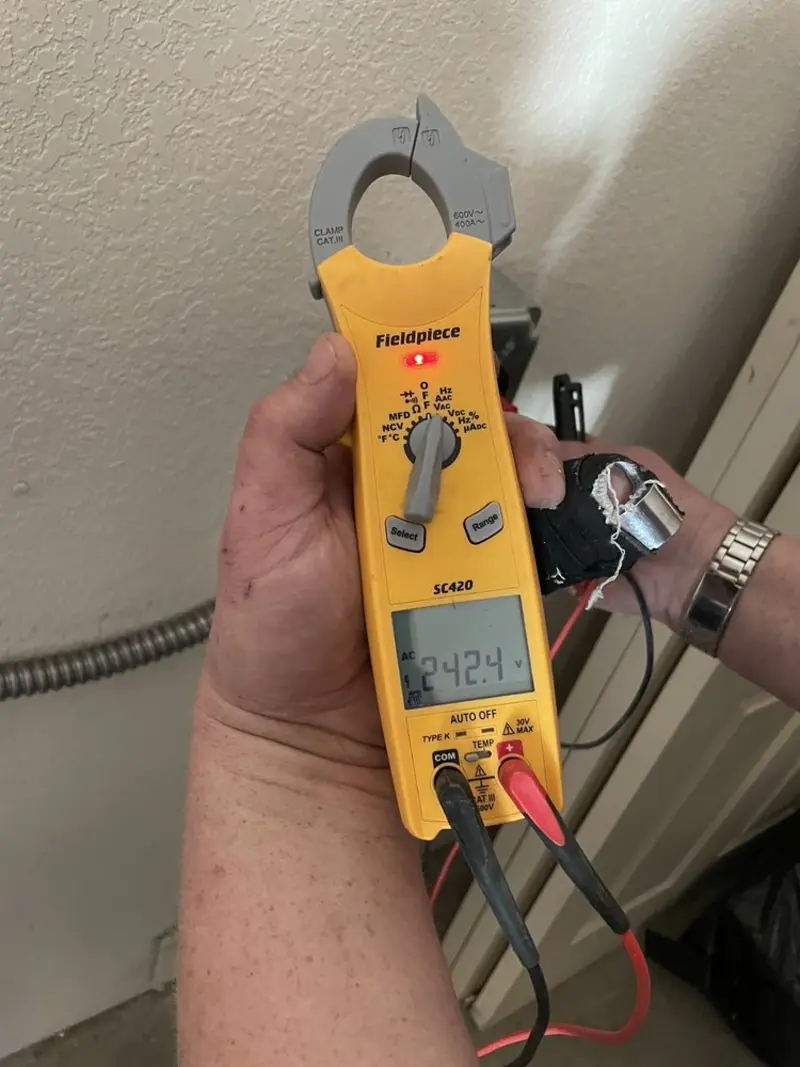 Voltage testing with clamp meter during Generator Installation in Delshire